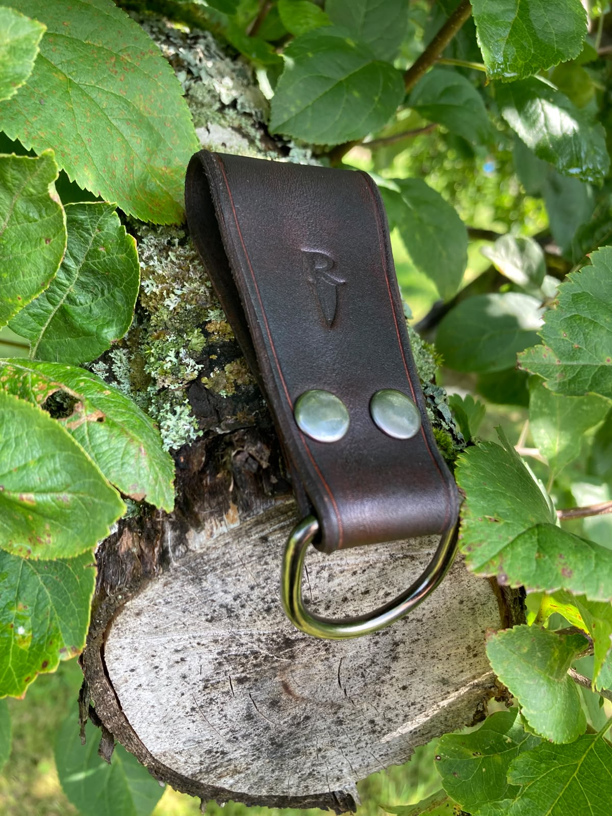 Dark brown leather dangler with Roland's Blades stamp